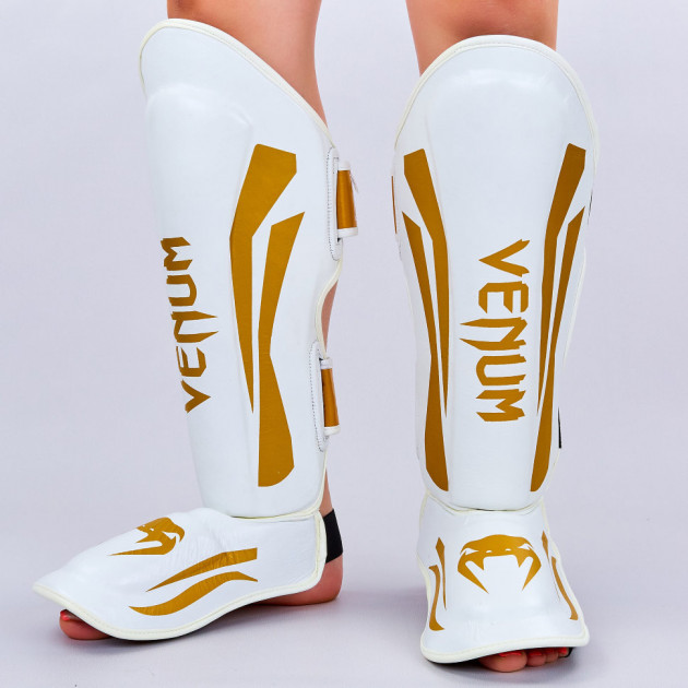 Защита для голени и стопы Муай Тай, ММА, Кикбоксинг кожаная VNM ELITE VL-8314 (р-р M/166-173 см , белый-золотой)
Защита для голени и стопы Муай Тай, ММА, Кикбоксинг кожаная VNM ELITE VL-8314 (р-р M/166-173 см , белый-золотой)