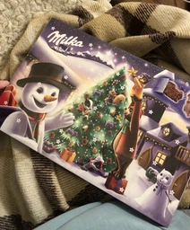 Шоколад Milka Адвент Календарь (Санта с санями) с 24 фигурками разных персонажей 200 г фото от покупателей 1