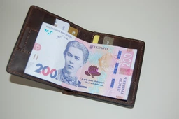 Шкіряне портмоне унісекс з накладною монетницею GRANDE PELLE 11224 Червоне фото від покупців 2