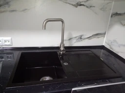 Кухонная мойка гранит GRANADO Valencia black shine (0701) + сифон одинарный для кухонной мойки Nova фото от покупателей 9
