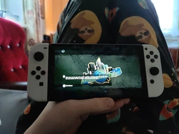 Набір портативна ігрова приставка Nintendo Switch OLED with White Joy-Con + Гра The Legend of Zelda: Breath of the Wild (картридж, російська версія) фото від покупців 1