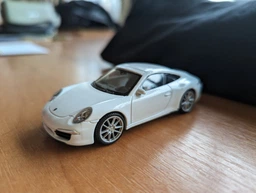 Машина металева PORSCHE 911 "WELLY" 44042CW масштаб 1:43 (Білий) фото від покупців 1