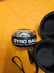 Эспандер ручной гироскопический кистевой тренажер для кистей рук Gyro Ball с LED подсветкой от силы раскрутки фото от покупателей 1
