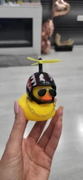 Аксессуар на торпеду в авто Crazy Duck утка в военном шлеме с оружием фото от покупателей 3