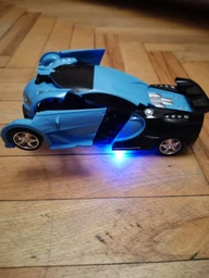 Машинка трансформер на радіокеруванні AToys Bugatti-Robot 1:18 світлові ефекти Чорно-блакитна фото від покупців 4