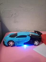 Машинка трансформер на радіокеруванні AToys Bugatti-Robot 1:18 світлові ефекти Чорно-блакитна фото від покупців 3