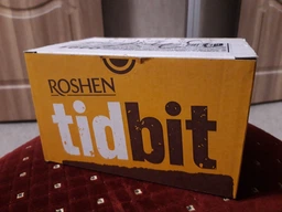 Упаковка шоколадных батончиков Roshen TidBit молочные с нугой, мягкой карамелью и арахисом 50 г х 24 шт (4823077630491) фото от покупателей 2