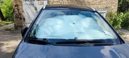 Автомобільна сонцезахисна парасолька на лобове скло 135×79 см UV, складна, чорно-сіра XJ5106 фото від покупців 7