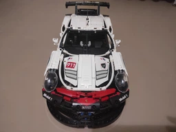 Конструктор машинка технік Porsche 911 RSR Racing Vesion Technology на 1630 деталей в масштабі 1:10 Порше авто гоночна версія фото від покупців 15