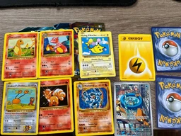 Детские карточки Pokemon Go на 4 пака (1 пак - 10 штук), игральные бумажные 40 карточек Покемонов для коллекционирования фото от покупателей 1