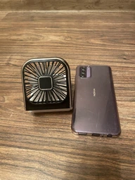 Вентилятор міні портативний акумуляторний з павербанком 3000 mAh з підставкою для телефона ручний на шию з USB білий + чорний фото від покупців 1