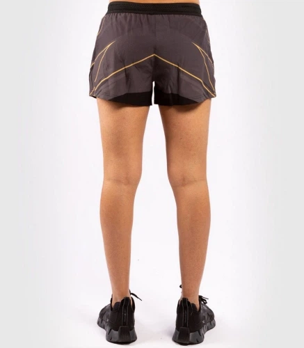 Женские шорты Venum Authentic UFC FightNight Black Gold (VNMUFC-00072-126-XS) - Фото 2 Женские шорты Venum Authentic UFC FightNight Black Gold (VNMUFC-00072-126-XS) - изображение 2