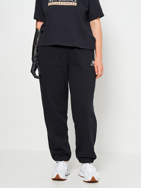 Акція на Спортивні штани на флісі жіночі New Balance Essentials Stacked Logo WP31530BK M Чорні від Rozetka