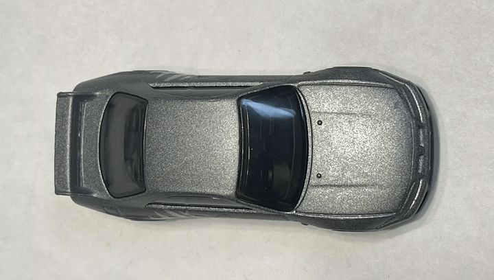 Машинка Базова Hot Wheels Nissan Skyline GT-R R33 Godzilla J-Imports 1:64 HTD96 Grey - зображення 4