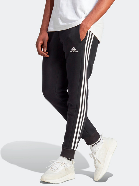 Spodnie dresowe męskie adidas Fleece 3-Stripes Tapered Cuff IB4030 L Czarne (4066762310104) - obraz 1