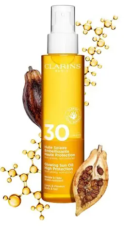 Солнцезащитное масло-спрей для тела Clarins Glowing Sun Oil High Protection SPF 30 150ml - Фото 2 Солнцезащитное масло-спрей для тела Clarins Glowing Sun Oil High Protection SPF 30 150ml - изображение 2