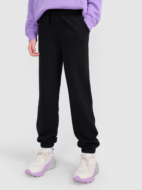 Spodnie dresowe młodzieżowe dziewczęce joggery 4F 4FJWMM00TTROF1189-20S 140 cm Czarne (5905700384663) - obraz 1