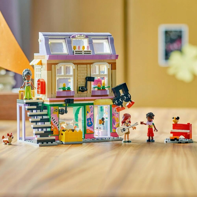 Zestaw klocków LEGO Friends Sklep muzyczny i mieszkanie 483 elementy (42653)  - obraz 4