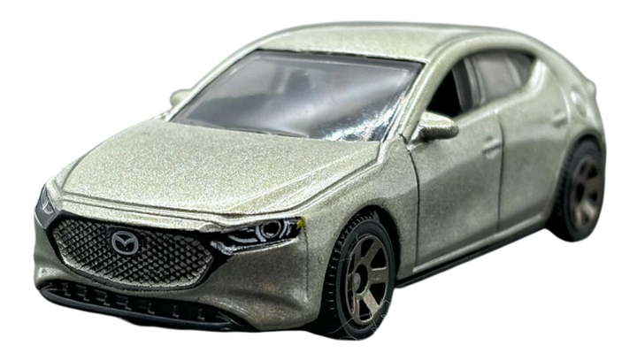 Машинка Большой Город Matchbox 2019 Mazda 3 Road Trip 1:64 HVP04 Gold - Фото 3 Машинка Большой Город Matchbox 2019 Mazda 3 Road Trip 1:64 HVP04 Gold - изображение 3