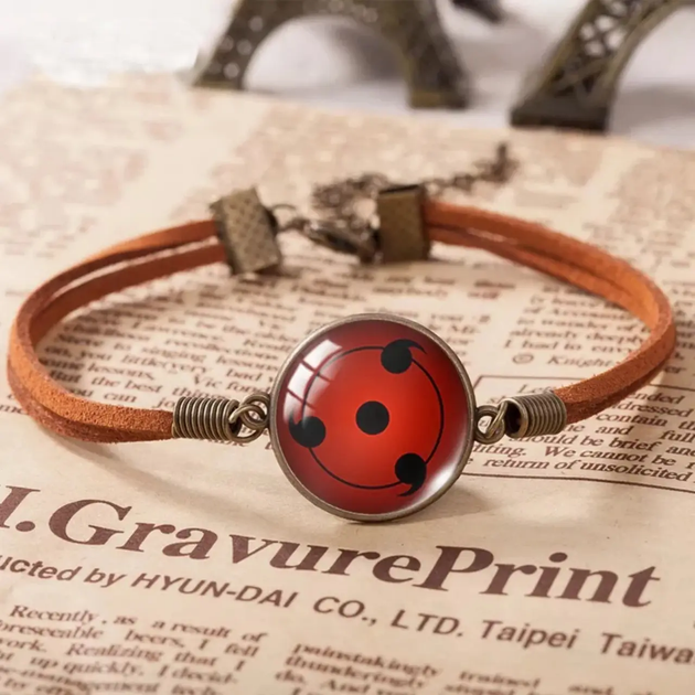 Браслет аниме Naruto шаринган Наруто Sharingan Shippuuden в виде красного амулета - Фото 1 Браслет аниме Naruto шаринган Наруто Sharingan Shippuuden в виде красного амулета - изображение 1