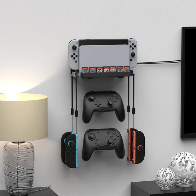 Настенное крепление DOBE для консоли и зарядной dock станции Nintendo Switch 2 / Nintendo Switch (OLED) + Два держателя для контроллера Switch Pro + Место для 28 игровых картриджей / крючки под Joy-Con / кронштейн на стену - изображение 5