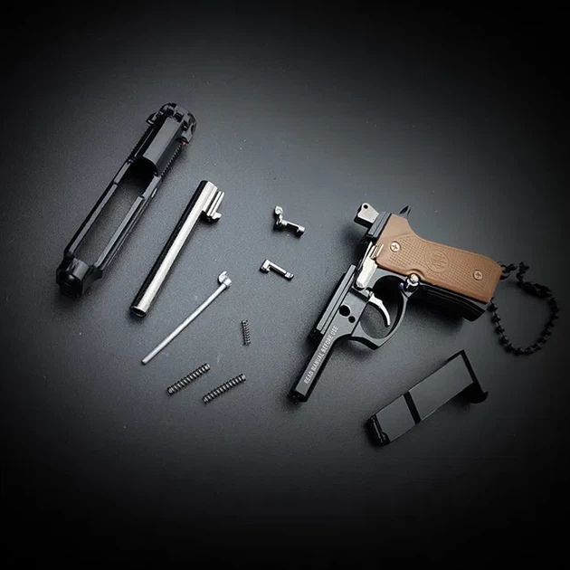 Брелок розбірний пістолет Антистрес M92 BERETTA чорного кольору, іграшка з металу та пластику - Фото 6 Брелок розбірний пістолет Антистрес M92 BERETTA чорного кольору, іграшка з металу та пластику - зображення 6
