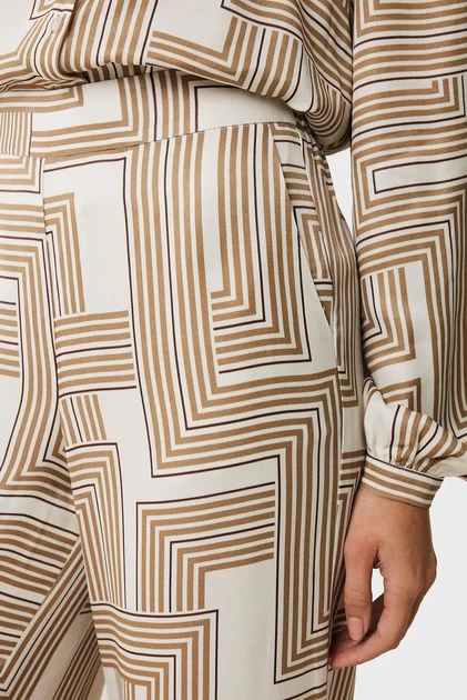 Жіночі бежеві брюки з візерунком Graphic pants Mexx 34 MF007001751W - Фото 4 Жіночі бежеві брюки з візерунком Graphic pants Mexx 34 MF007001751W - изображение 4