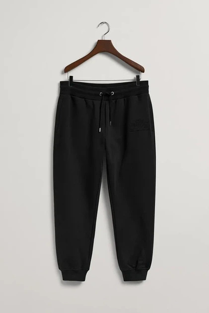 Чоловічі чорні спортивні штани TONAL ARCHIVE SHIELD PANTS Gant L 2039023 - Фото 7 Чоловічі чорні спортивні штани TONAL ARCHIVE SHIELD PANTS Gant L 2039023 - изображение 7