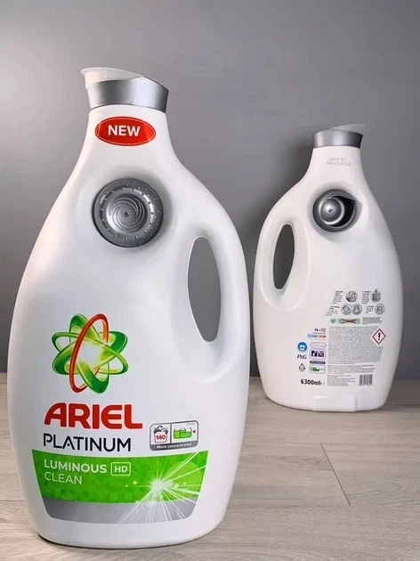 Гель для прання універсальний Ariel PLATINUM LUMINOUS 6,3 л - Фото 1 Гель для прання універсальний Ariel PLATINUM LUMINOUS 6,3 л - зображення 1