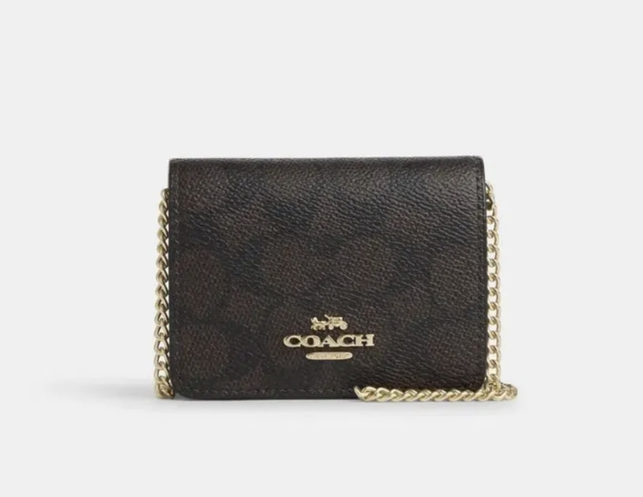 Сумка-гаманець Coach Mini Wallet on a Chain Signature Canvas - Фото 1 Сумка-гаманець Coach Mini Wallet on a Chain Signature Canvas - зображення 1