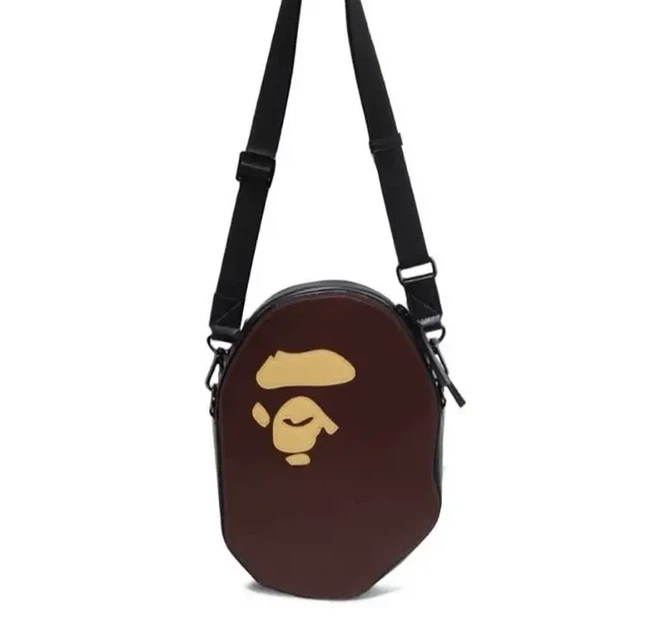 Сумка через плечо Bape Ape Head Shoulder Bag в коричневом цвете. - Фото 2 Сумка через плечо Bape Ape Head Shoulder Bag в коричневом цвете. - изображение 2