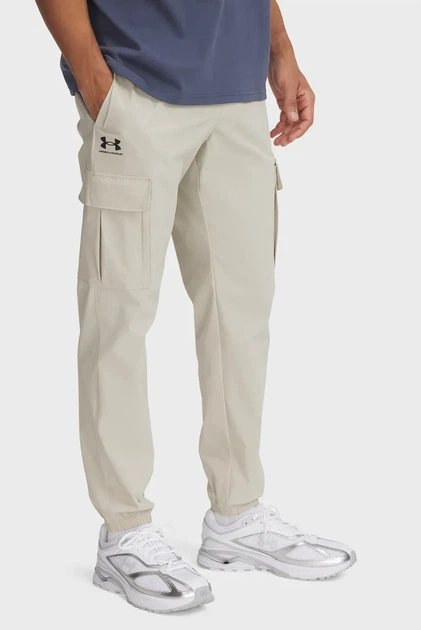 Чоловічі бежеві спортивні штани UA Vibe Woven Cargo Pants Under Armour S 1386558-289 - Фото 1 Чоловічі бежеві спортивні штани UA Vibe Woven Cargo Pants Under Armour S 1386558-289 - зображення 1