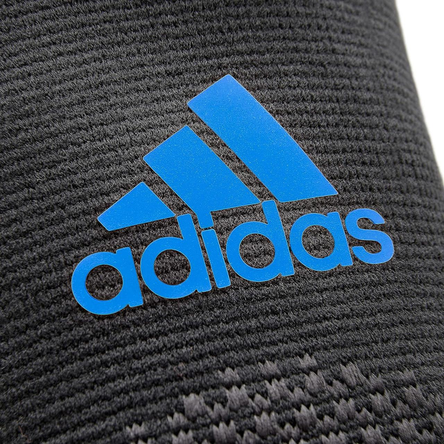 Фіксатор Ліктя Adidas Performance Elbow Support(ADSU-13331BL) M Чорний/Синій - Фото 2 Фіксатор Ліктя Adidas Performance Elbow Support(ADSU-13331BL) M Чорний/Синій - изображение 2