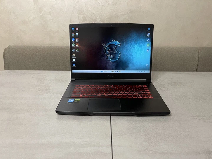 Игровой ноутбук MSI Thin GF63 12VE / 15.6" (1920x1080) IPS / Intel Core i5-12450H (8 (12) ядер по 3.3 - 4.4 GHz) / 16 GB DDR4 / 512 GB SSD M.2 / nVidia GeForce RTX 4050, 6 GB GDDR6, 96-bit / WebCam б/у + Подарок Проводная мышь / USB - Фото 2 Игровой ноутбук MSI Thin GF63 12VE / 15.6" (1920x1080) IPS / Intel Core i5-12450H (8 (12) ядер по 3.3 - 4.4 GHz) / 16 GB DDR4 / 512 GB SSD M.2 / nVidia GeForce RTX 4050, 6 GB GDDR6, 96-bit / WebCam б/у + Подарок Проводная мышь / USB - изображение 2