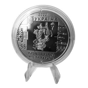 Медаль України „Київщина. Міста-героїв: Буча, Гостомель, Ірпінь» у капсулі на підставці