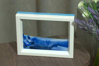Картина-антистресс Moving Sandscapes двухсторонняя в бело-голубой рамке 18,5х14,3 см синяя