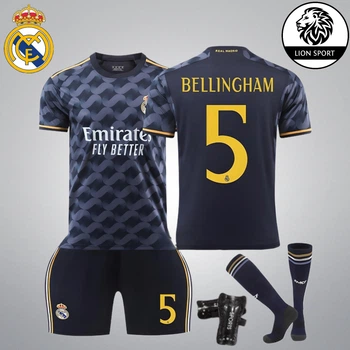 Комплект футбольна форма дитяча Lion SPORT Real Madrid BELLINGHAM (Реал Мадрид Белінгем) з гетрами (розмір 34-38) та щитками, розмір 24 розмір, ріст 130-140 см, чорний з помаранчевим