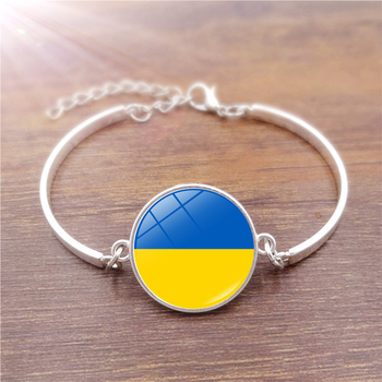 Браслет патріотичний металевий із прапором України.