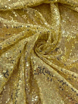 Тканина з паєтками на сітці світло золотий 130см 200г/м2 1пог.м(350-37)