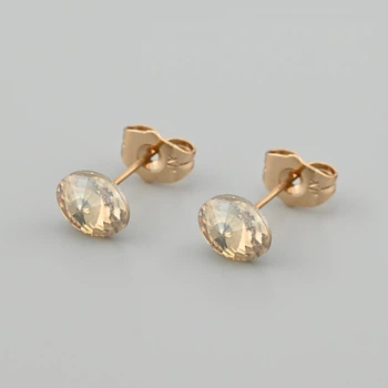 Сережки з кристалами Swarovski 53406 розмір 8х6 мм колір шампань вага 1.0 г позолота 18К
