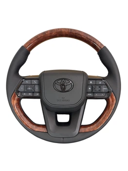 Руль для Toyota Land Cruiser 100, Prado 120. В стиле LC300. Под цвет салона. Логотип – черный глянец.