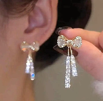 Женские сережки Бантики в стразах и камушках jewelry Золотистые-белые