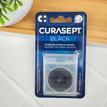Зубная нить Curasept Floss черная вощеная с хлоргексидином, 50 м