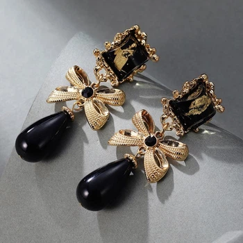 Сережки-кліпси “Black Orchid” масивні золотисті стиль вінтаж бант 8161