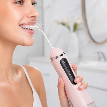 Ирригатор для полости рта портативный аккумуляторный 200 мл Oral Irrigator, с 4 насадками для ухода за зубами, деснами и брекетами Розовый, AND-1-37-Pink