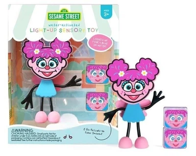 Сенсорна світлова іграшка для ванни Glo Pals Вулиця Сезам - Фігурка Еббі з кубиками (0850016823397)