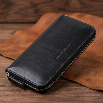 Кожаный женский средний кошелек на молнии от GRANDE PELLE Черного цвета (bg115fash62)