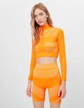 Спортивні шорти Bershka помаранчевий MNFPP843 M