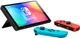 Игровая консоль Nintendo Switch OLED Неоновая синяя/неоновая красная (45496883409) - изображение 3