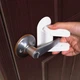 Детский замок Door Lever Lock блокиратор на дверные и оконные ручки уп 2шт (3024) - изображение 1